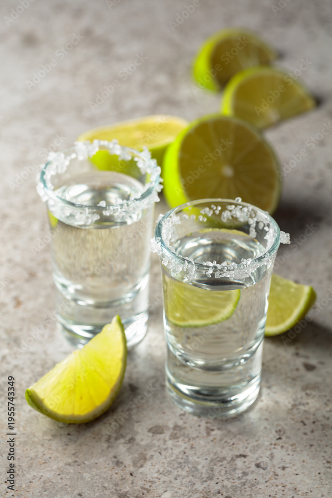 Fototapeta premium Tequila with salt and lime slices.