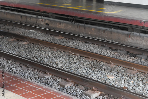 Train tracks made of strong metal and gravel. Metro Rail tracks well-maintained for safe and smooth travel and operation for daily city commuters.