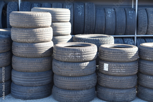 Stacks of Used Car Tires at Auto Service Shop Outdoor Storage Yard