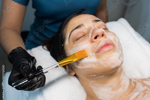 Fotografi Woman receiving deep facial cleansing mask treatment