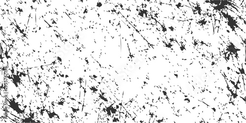 An abstract black grunge background vector illustration featuring a dirty ink splatter texture with paint stains and liquid drops on a light art pattern design