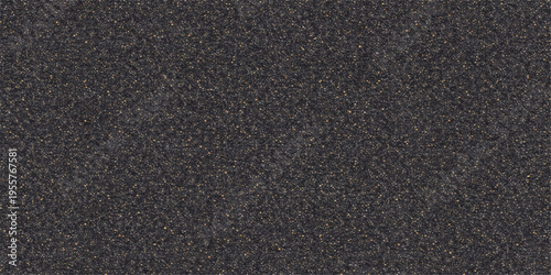 An abstract closeup of a dark, rough black leather and fabric material texture with a textured stone surface pattern resembling a grey asphalt road backdrop