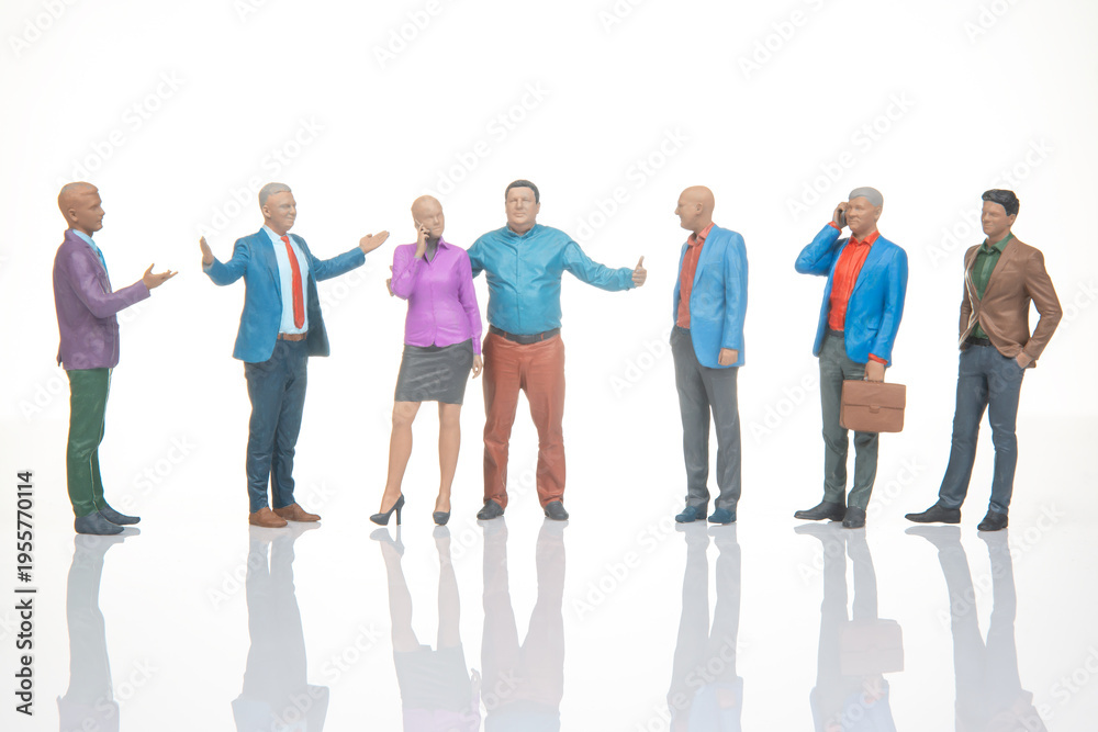 Fototapeta premium Miniature figurines of people engaging in conversation and interaction in a simple setting