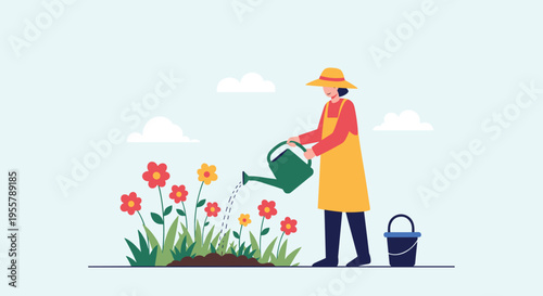 Woman in a yellow apron and sun hat carefully waters a vibrant garden of red and yellow flowers on a bright sunny spring day.