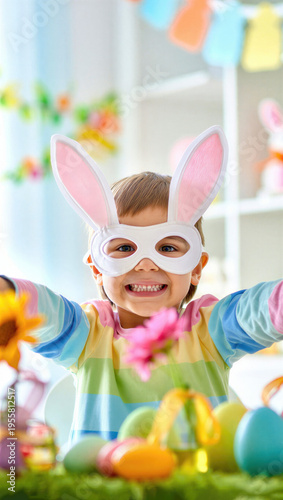 Joyful child in bunny mask at festive table with colorful easter decorations smiling brightly, springtime celebration, playful holiday scene, cheerful atmosphere, vibrant festive environment