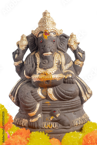 Gold decorated Ganesha idol with marigold flowers, for Ganesha Chaturthi worship