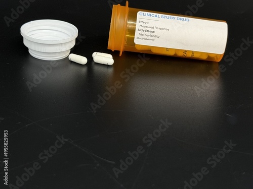 Experimental pharmaceutical capsules in prescription bottles, medical research concept