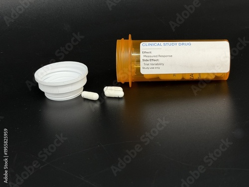 Experimental pharmaceutical capsules in prescription bottles, medical research concept