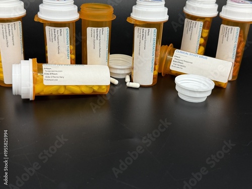 Experimental pharmaceutical capsules in prescription bottles, medical research concept
