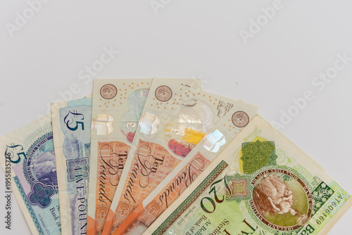 British pound sterling banknotes arranged in fan symbolizing UK finance and economy