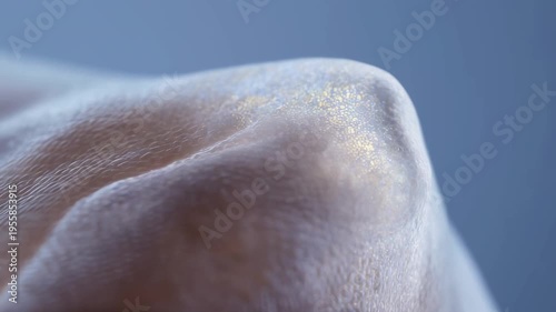 Textured organic surface with golden shimmer