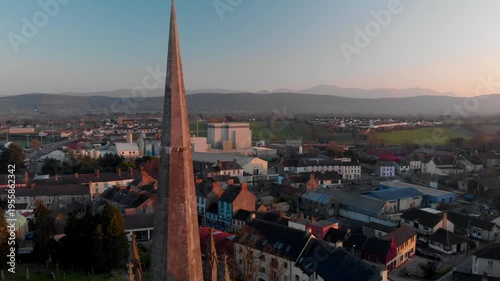 Serenity above Tipperary town, showcasing St. Mary's Church spire and community spirit at golden hour.