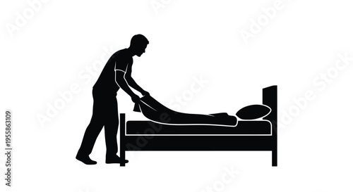 Man making a bed depicted in a stark black silhouette