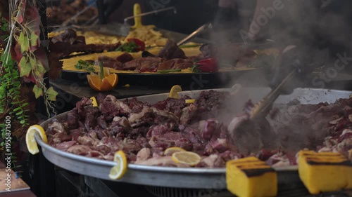 Large cooking pot with meat and vegetables at a market in Romania during the day