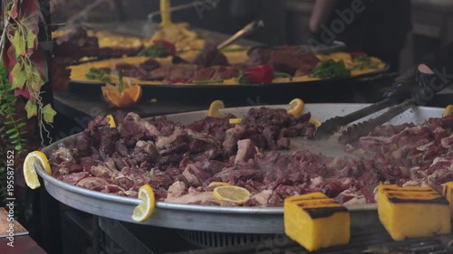 Large cooking pot with meat and vegetables at a market in Romania during the day