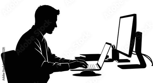 Silhouette of a man working on a laptop and computer, focused on coding or typing in a modern office setting.