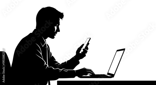 Silhouette of a man working on a laptop and holding a smartphone, focused on screen