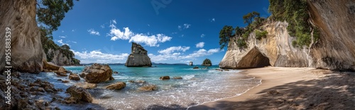 Idyllic beach scene with rock formations and turquoise water.