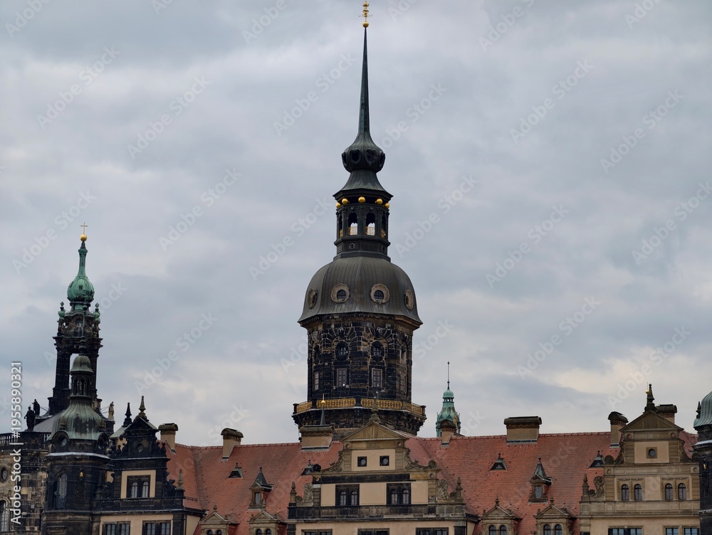 Obraz premium Historic cityscape vista. Expansive view of historic structures and castlelike silhouette under cloudy skies