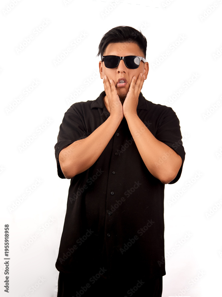 Fototapeta premium Young man touching cheeks with shocked expression isolated on white background