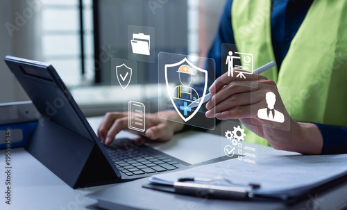 Canvastavla Safety specialist using laptop with digital protection icons, workplace compliance monitoring, risk prevention strategy and occupational health management system concept