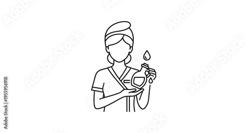 Spa Therapist Holding Essential Oil Bottle with Droplet