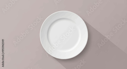 A white plate sits on a light gray surface with a shadow cast to the right.