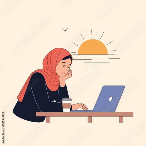 Young woman in hijab working on laptop at a table by the ocean with a coffee cup at sunset