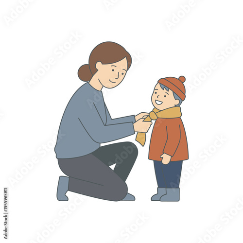 Mother dressing her son in a warm scarf and hat for a cold day outing