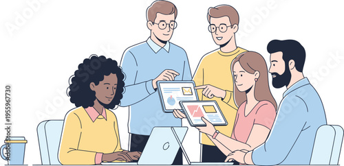 Diverse team collaborating on a project with laptop and papers