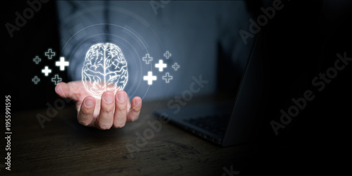 Glowing brain with positive plus signs above a human hand. Mental health, psychology, AI, digital technology, intelligence, neuroscience, data analysis, innovation, and smart healthcare solutions.