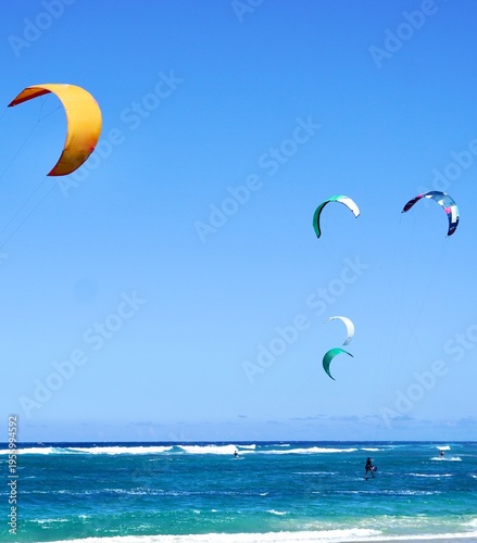 Kiteboarding Kites float gracefully over Kite Beach in Cabarete, Dominican Republic