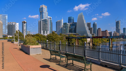 Downtown Austin - A wide-angle view of modern skyline of Downtown Austin, at shore of Lady Bird Lake, as seen from James D. Pfluger Pedestrian Bridge, Texas, USA.