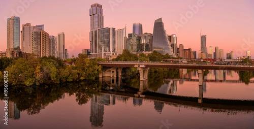 Dusk at Austin - A panoramic sunset view of modern skyscrapers towering at shore of Lady Bird Lake at Downtown Austin, Texas, USA.