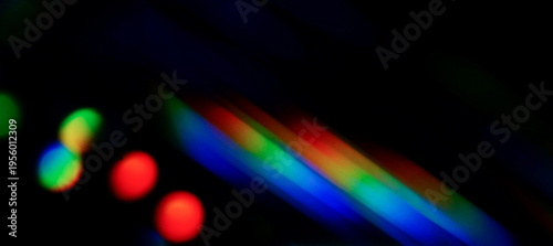 Abstract prism light reflection rainbow colors ,leak overlay effect on black background banner. Template, trend design, creative defocused effect .