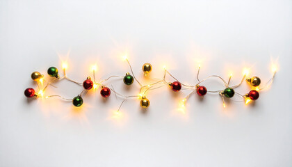 String of festive fairy lights with small red green and gold baubles