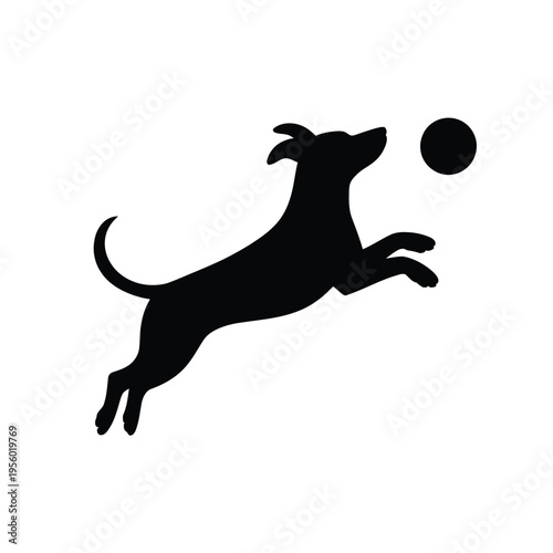 A black silhouette of a dog leaping to catch a floating ball