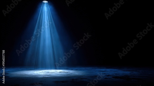 A single spotlight shining down on a dark stage