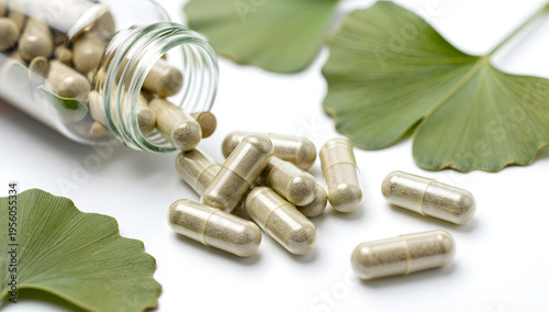 Capsules and Nature's Gift: A close-up captures a collection of capsules spilling from a glass bottle, alongside fresh ginkgo leaves.