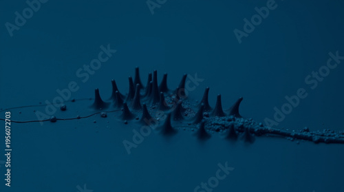 Mysterious scientific phenomenon with sharp conical protrusions rising from liquid surface, resembling electrostatic dis