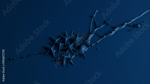 A deep blue background with an abstract star shaped structure intertwined with dendritic lines, resembling liquid bursti