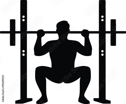 A strong male athlete silhouette performs a heavy barbell weightlifting workout to build muscle and power during a fitness training session at the gym