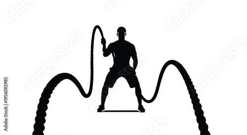 Silhouette of fit man exercising with battle ropes in dynamic motion for fitness and workout concept