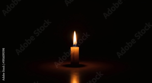 single candle burning in darkness, memorial flame perfect for Israel Memorial Day
