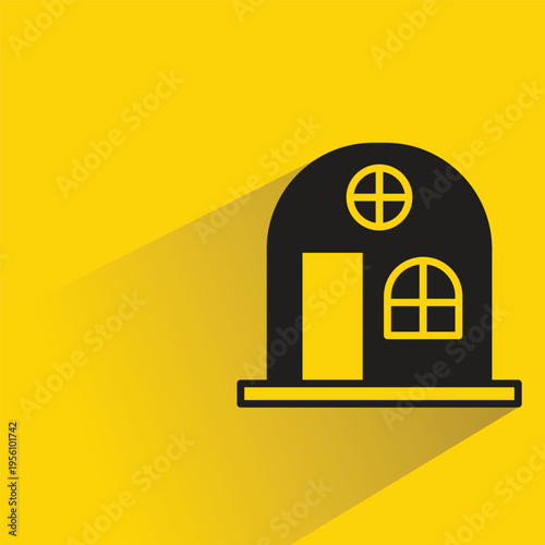 house building icon with shadow on yellow background