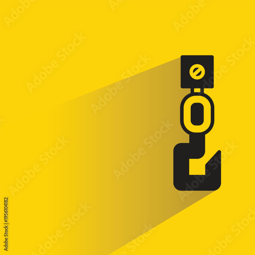 crane hook with shadow yellow background
