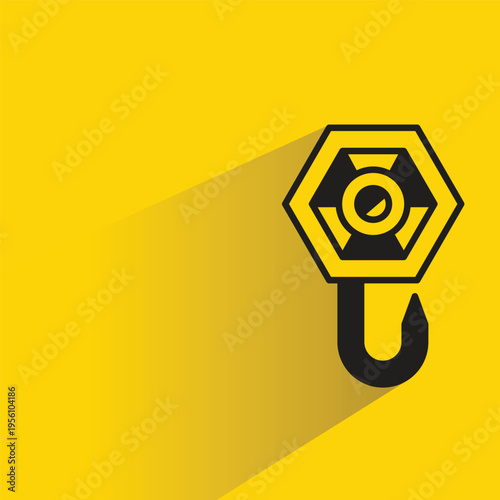 crane hook with shadow yellow background