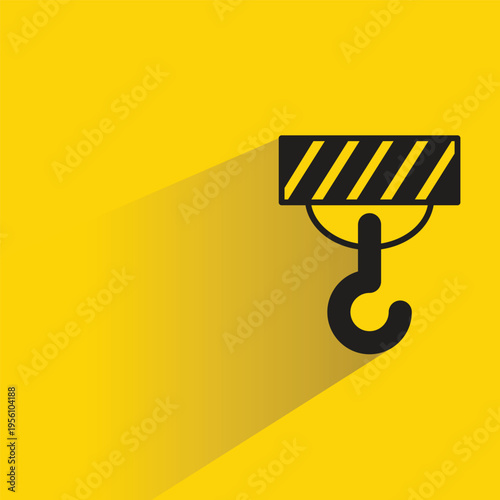 crane hook with shadow yellow background
