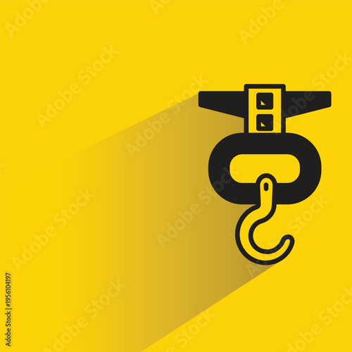 crane hook with shadow yellow background