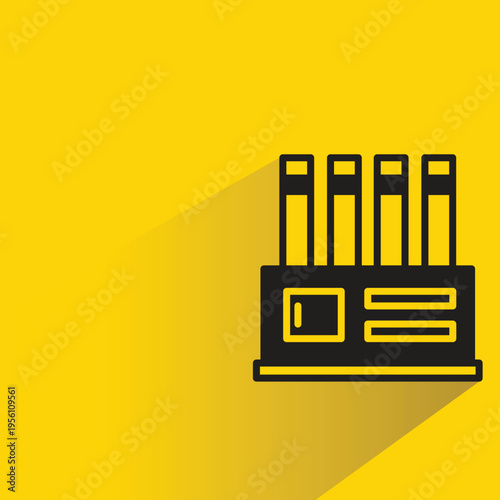 factory building icon with shadow on yellow background